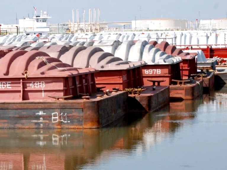 moving cargo by barge at port freeport